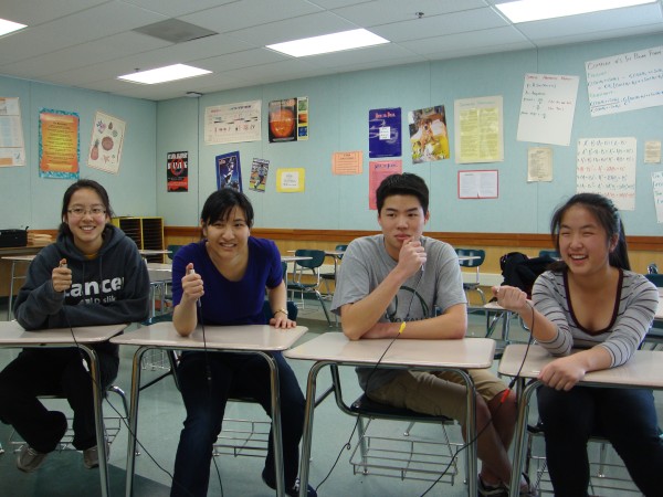 Sabrina Li, Kristie Huie, Justin Liu, and Belinda Liu pose intelligently for the camera.