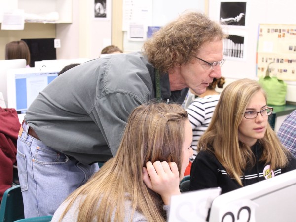 Photography teacher Jeff Vendsel assists students in creating the new yearbook. Photo by Michael Castillo