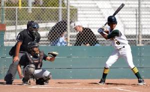 Christian Merriweather prepares to swing during an intense game. Photo by Jes Smith.