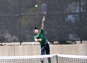 Spencer Dong serving the ball against his opponent