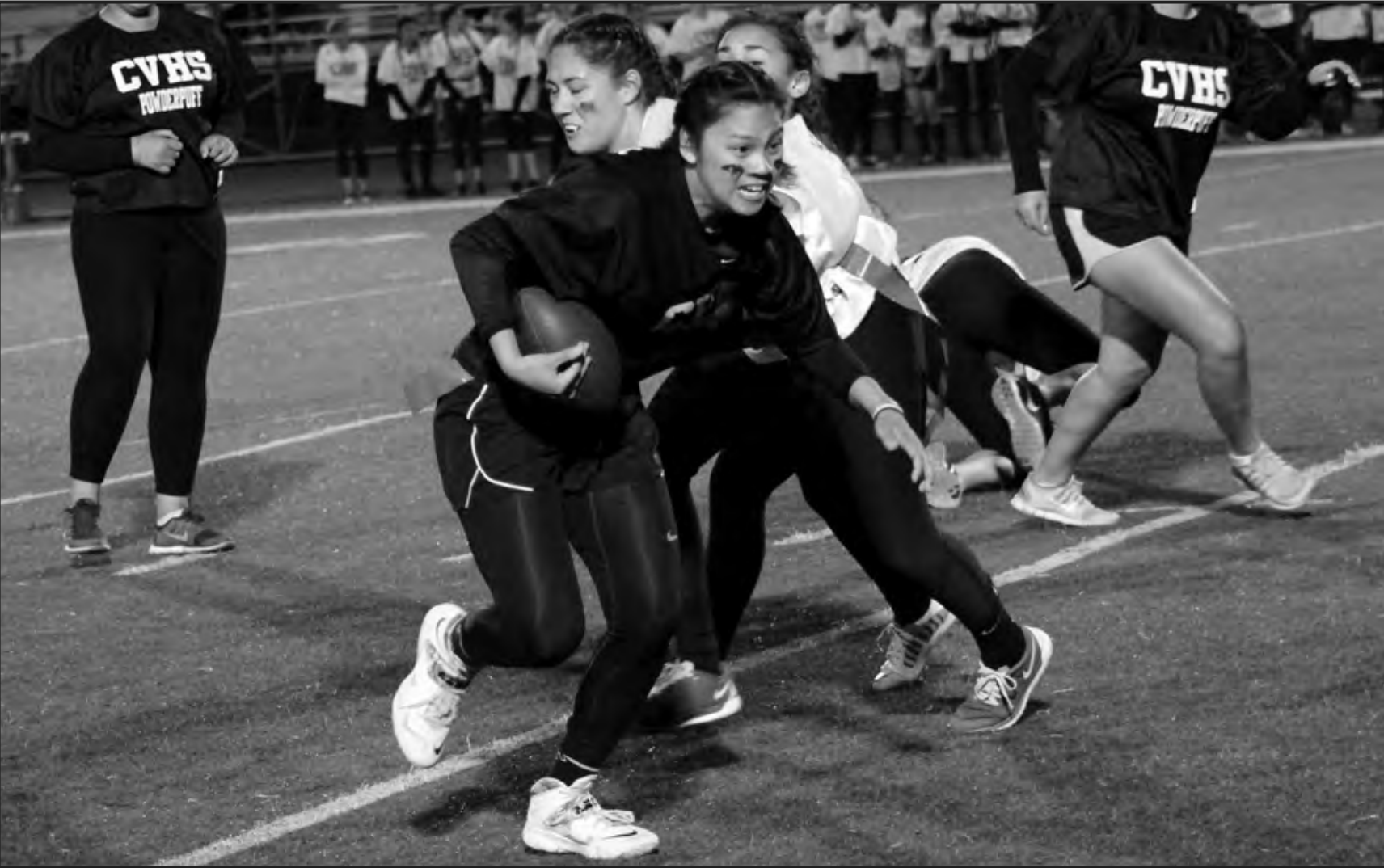 Powderpuff player Micaella Suarez protects the football during the game. Photo by Gavin Halloran
